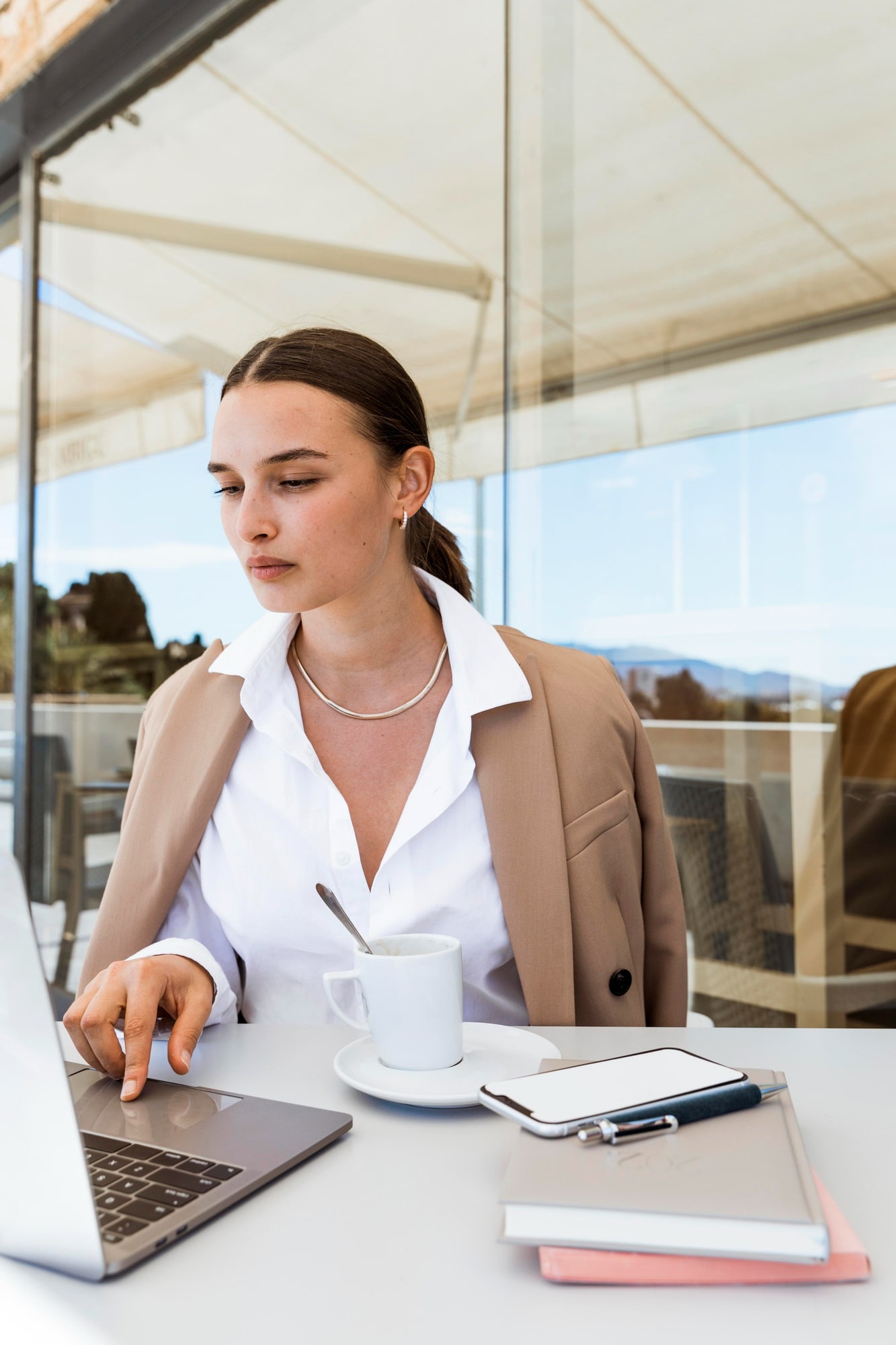 medium-shot-woman-working-laptop-min